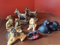 Group shot of all nine dog figurines and bookends