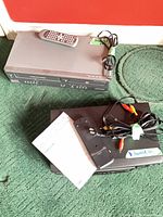 Top view of both players with remotes and cables