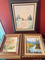 All three framed paintings grouped