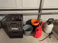 all items together: sprayer, watering can, three buckets, two milk crates