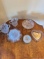 Group shot of all eight pressed glass pieces