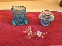 Group shot of all three glass pieces: owl toothpick holder, blue hat, clear dog figurine