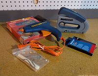 Full lot showing ThermoGrip glue gun with accessories and Mastercraft stapler with fasteners