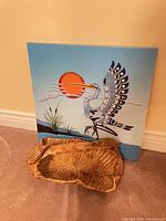 Canvas art and carved bowl full view