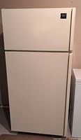 Front view of Kenmore cream top-freezer refrigerator