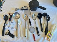 Overall view of Pampered Chef pot and assorted utensils laid out