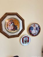 All three plates hanging on wall for size and grouping reference
