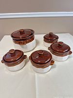 Full set showing one large and three small lidded bowls