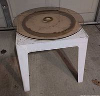Side table with glass lazy susan resting on top