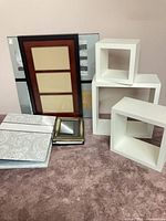 All items grouped: shelves, frames, albums visible