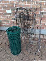 Group shot of fencing roll, wire panels, tomato cages