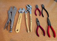 All eight hand tools laid out for full view