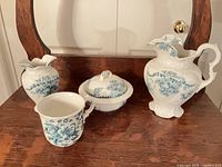 All four porcelain pieces grouped