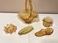 Group view of all five amber glass pieces