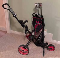Full view of bag on FXMax push cart showing clubs and cart structure