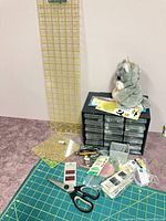 Group shot showing rotary mat, rulers, organizer, scissors, notions