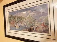 Framed harbour scene print in black frame