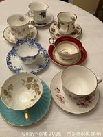 Group view of six assorted teacup and saucer sets