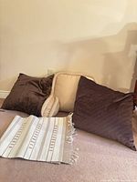 All pillows and runner grouped on floor