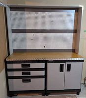 Full view of assembled workbench showing hutch, top surface and both base cabinets