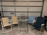 Group shot of all five folding chairs lined up in garage