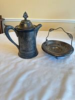 Coffee pot and bride’s basket side by side