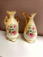 Both ceramic pieces side by side showing shape, floral design and gold accents