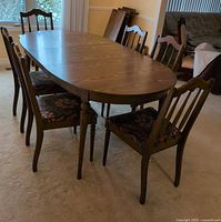 Table with chairs in place, shows full set