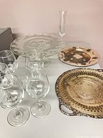 Group view showing wine glasses, cake stand, vase, and both trays