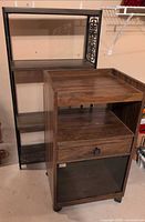 Metal shelf and rolling cart side by side