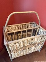 overall view of wicker magazine rack showing handle and weave