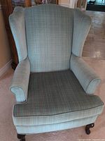 front view of wingback chair showing upholstery pattern and overall form