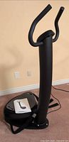 Full view of Zen Pro vibration machine with handlebars and platform