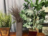 All three artificial plants side by side on table