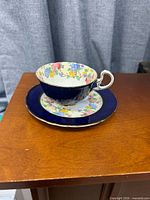 Teacup on saucer on plate showing set