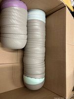 Stack of ribbed taupe bowls showing quantity and design