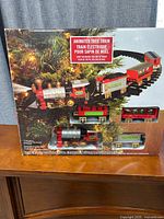 Front of retail box showing locomotive, cars and track