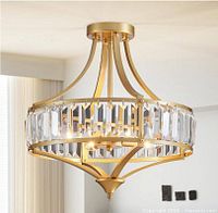 Stock image of assembled gold crystal semi flush mount ceiling light