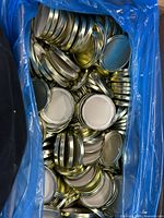 Box of Massilly canning lids in blue liner