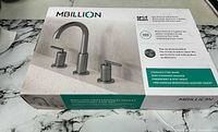 Sealed retail box showing MBillion stainless steel widespread faucet set and feature list