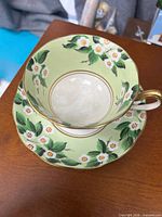 Teacup interior and saucer showing pattern