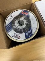 Wool wheel disc inside opened box showing label and size