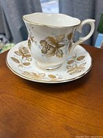 Teacup on saucer showing pattern and shape