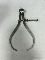 Full view of Starrett spring caliper legs and adjustment screw