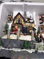 Winter village base with bridge, figures, house detail in foam packing