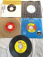 All five records laid out with sleeves visible