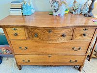 Front view showing five drawers, hardware, overall design