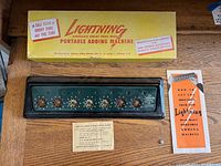 Full lot showing adding machine, box, stylus, instruction card and brochure