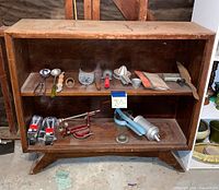 Front view of shelving unit with two shelves and splayed feet