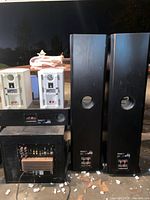 Group shot showing two VR2 towers, Velodyne DLS subwoofer rear panel, VRC center, and two CR65 bookshelf speakers